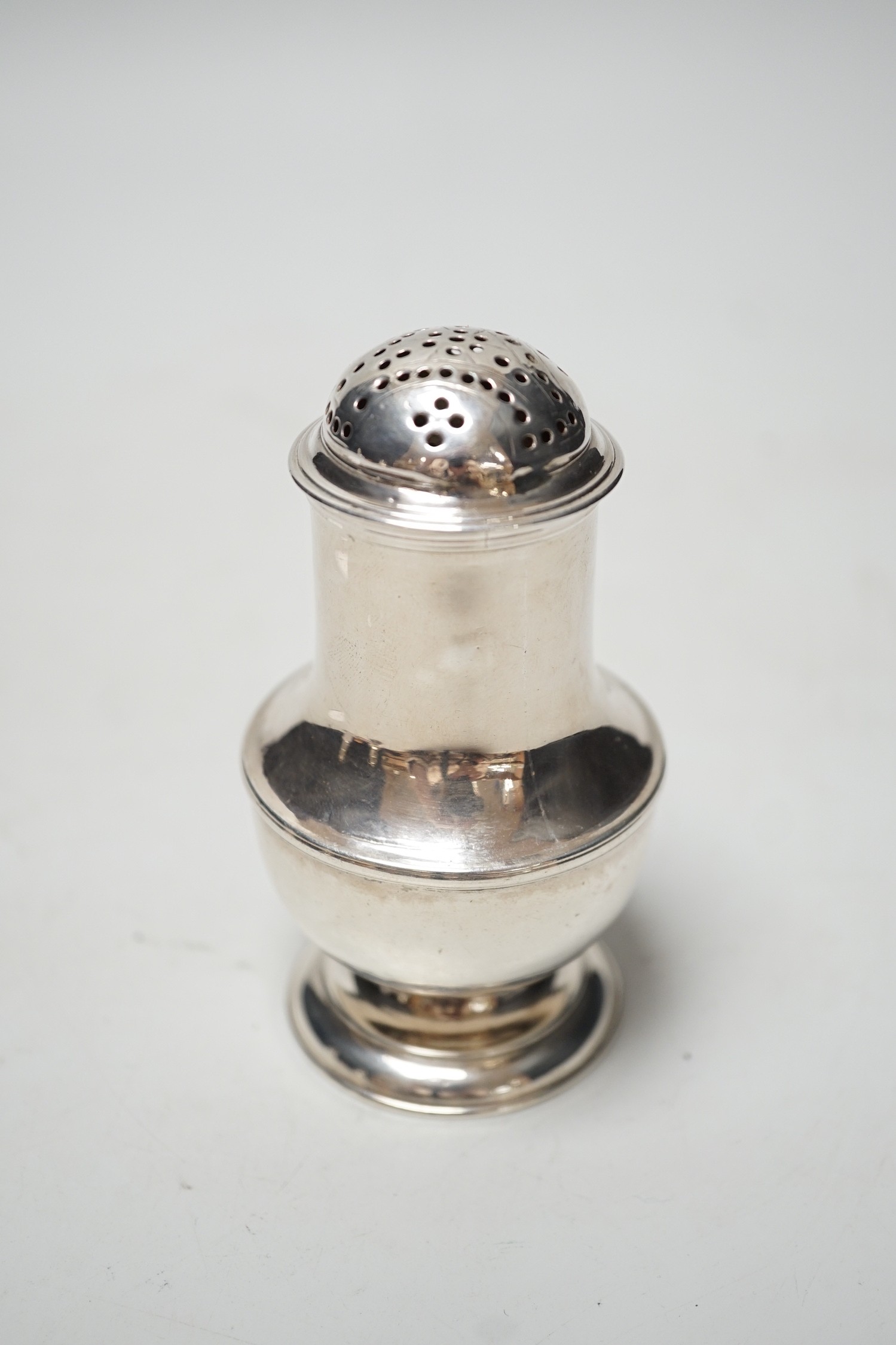 An early George II silver bun shaped pepperette, Thomas Bamford, London, 1728, 10.6cm, 4.2oz.